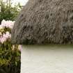 Detail of roof corner with heather thatch; Tullochard, Plockton.