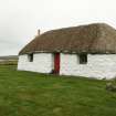 View of early 20th century marram thatched cottage; Tigh na Boireach, Reumisgarry, North Uist.