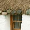 Detail of stone weights over doorway; Tigh na Boireach thatched cottage, Reumisgarry North Uist.