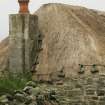 Detail of thatch and stone weights at chimney breast; probable 19th century cottage; Laimrig Ruadh, Berneray.