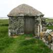 Rear view of thatched outbuilding with doorway;  Hilltop Cottage, North Uist.