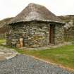 View of thatched outbuilding;  Rhugha Sinish, South Uist.