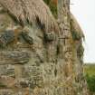 Detail of thatch at chimney stack;  99 Carnan South Uist.