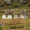 View of derelict 19th century  cottage with damaged and collapsing  formerly thatched roof; 472B South Lochboisdale, South Uist.