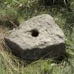 Detail of stone with central hole, door or gate support/base for  (metal) upright. This appears to be out of context.