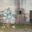 Laundry block. View of graffiti art from west.