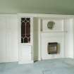  First Floor East Bedroom Detail of fitted cupboards,and fireplace