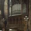 Chancel. Choir stalls and organ pipes on east side