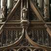 Chancel. Detail of carved angels in front of organ pipes.