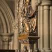 Chancel. Detail of carved angel on organ console.