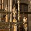 Chancel. Three carved angels on end of choir stalls.