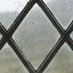 East window. Detail of writing etched on glass. (Image reversed for legibility.) 'This house is needing repair'