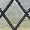 East window. Detail of writing etched on glass. (Image reversed for legibility.)