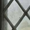East window. Detail of writing etched on glass. (Image reversed for legibility.) 'BABS... '