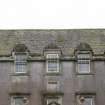 North front, detail of dormers with stone pediments above main entrance