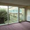Corridor. View looking out to landscaping.