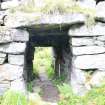View of entrance passage from broch interior, from S