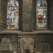 Crossing, north transept, view of war memorial with stained glass above