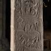 Larger Pictish cross slab, oblique view of rear with carved figures (including scale)