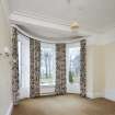 General view of South West bay bedroom with curved glass.