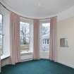 General view of North West bay bedroom with curved window glass.