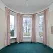 General view of North West bay bedroom with curved window glass.