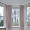 Detail of North West bay bedroom with curved window glass.