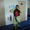 Angela Gannon putting on survival suit for helicopter journey from Benbecula to St Kilda