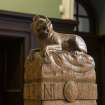 Detail of newel post depicting howling wolf, secondary stair, ground floor, Municipal Buildings, Stirling.