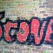 View of graffiti depicting the word 'Scone', which is visible on the the inside face of the WSW wall of the structure, at its NNW end.
