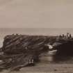 General view of the Cave Rock, Durban.  
The cave rock was at the headland harbour entrance, but was dynamited in the 1940s.  
Titled 'CAVE ROCK. BLUFF. DURBAN. 13. W&C'
PHOTOGRAPH ALBUM NO 11: KIRSTY'S BANFF ALBUM