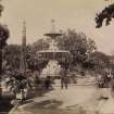 View of ornamental fountain, Town Gardens, Durban.
Titled 'JUBILEE FOUNTAIN. TOWN GARDENS.155'
The Jubilee Fountain once stood in the town gardens, it was removed after World War I.  The gardens are now called Habour Park.
PHOTOGRAPH ALBUM No 11: KIRSTY'S BANFF ALBUM