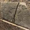 Obliquely lit view of medieval cross slab fragment (With scale).