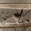 Obliquely lit view of medieval carved cross slab (with scale).