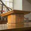 Detail of modern lecturn on communion table.