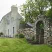 House and arched gateway, view from south