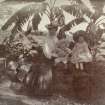 Woman and children seated on a wall, titled 'Mrs Edmonds, Walter, Lorna'; 'Glen Lorne, Rhosdesia 1907'. 
PHOTOGRAPH ALBUM NO.116: D M TURNBULL
