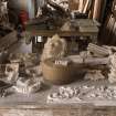 Interior. East range, ground floor, Workroom, north end. Detail of selection of plaster casts of friezes, and patterns and moulds for details such as egg and dart motifs and decorative corbels