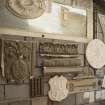Interior. East range. Entrance to workroom, detail of samples and patterns mounted on wall