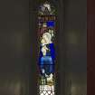 Under gallery area, detail of small stained glass window