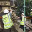 Buttress being removed by crane