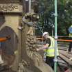 Buttress being removed by crane