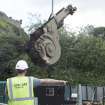 Buttress being removed by crane