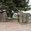 View of entrance to churchyard with Strathmiglo Pictish symbol stone on right