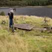 HES Photographer Steve Wallace recording a Macleod table tomb at Eilean Fhianain.