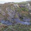 Oblique aerial view of Klondyke Quarry. The garden enclosure at bottom left of image (at NM73559 17073) is the southern half of a larger enclosure the northern part of which  destroyed by the expansion of Klondyke Quarry (post-1872 and pre-1899).