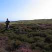 View of hut circle 'A' at NR 89249 30373 from the E, with Ziga Kokalj  providing scale.