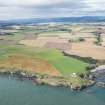 General oblique aerial view of the Aberdeenshire landscape centred on Todhead Lighthouse and Roadside of Kinneff.