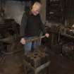 Calum Macleod demonstrating hammering at anvil