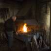 Calum Macleod working at forge